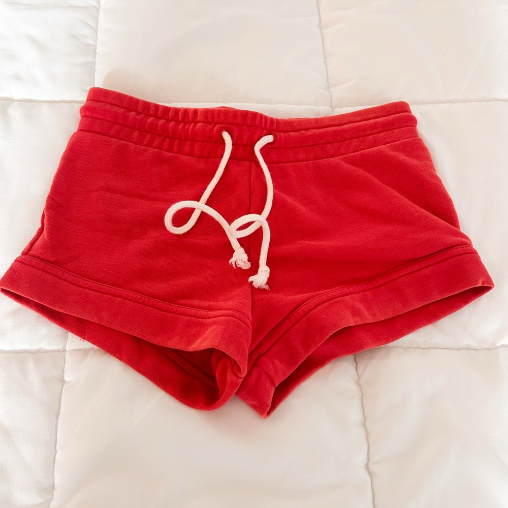 Out from under red shorts